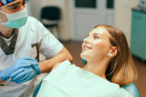 a patient with braces chatting with their orthodontist